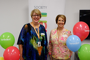 A photo of a smiling Jo Hewitt with her colleague at The Benevolent Society Liverpool Office